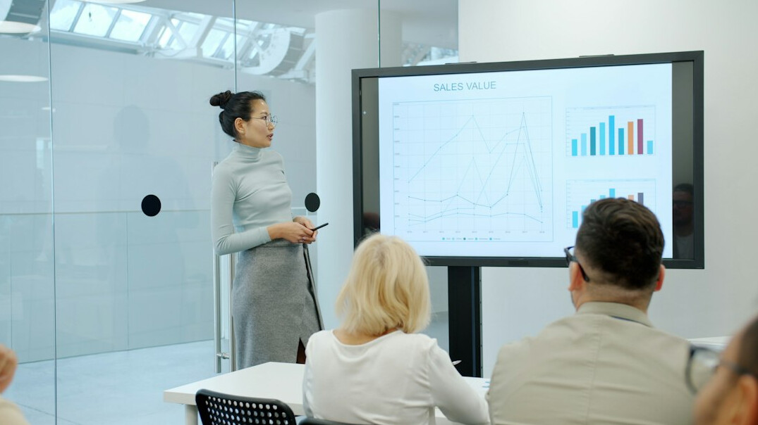 person giving presentation to team